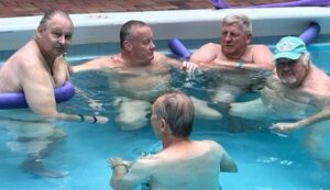 people relaxing in pool